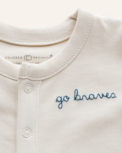 colored organics go braves personalization footed sleeper in ivory